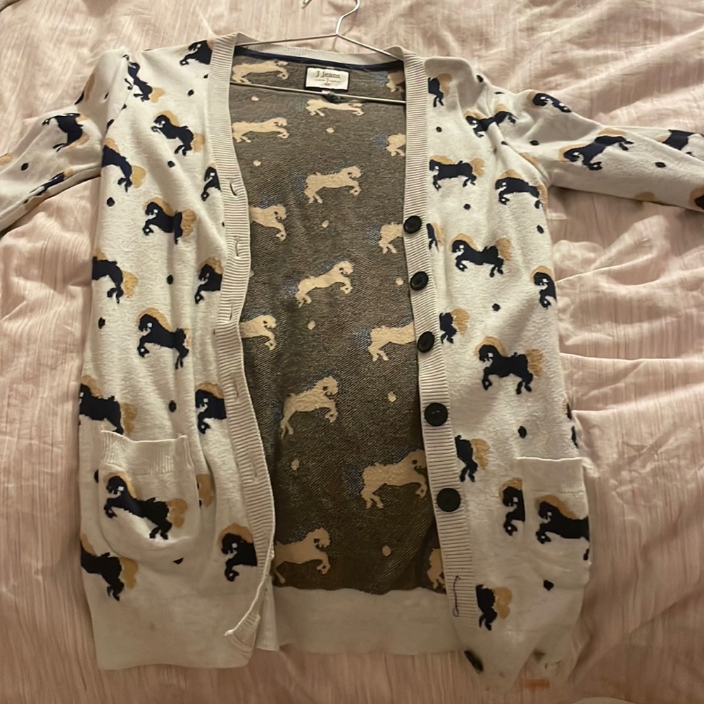 Sweater with horses on it